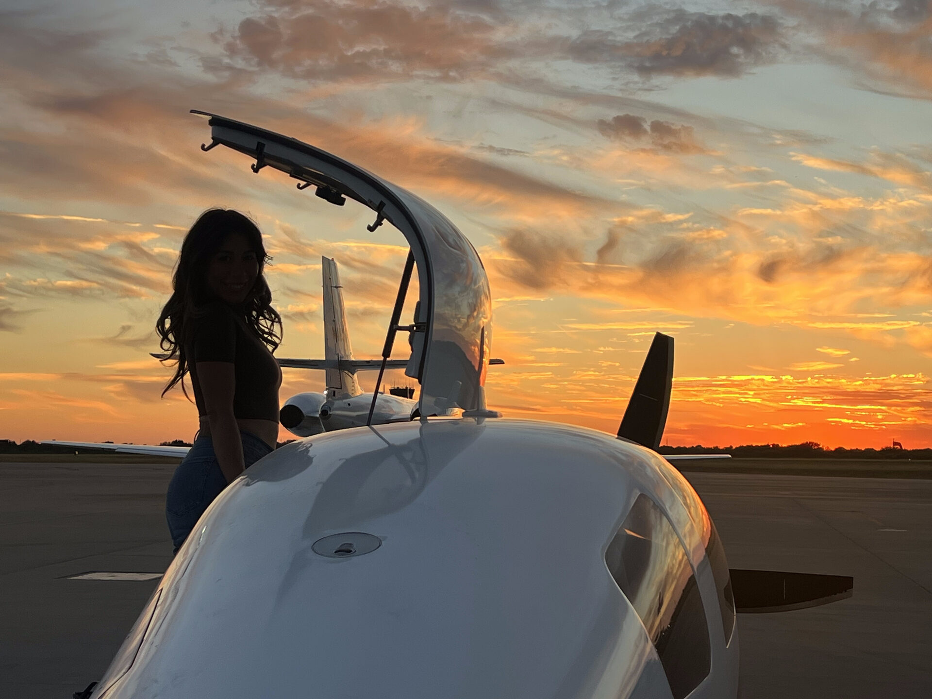 Sunset silhouette at the Lancair IV-P JetProp N331TP with canopy open on the ramp — Garrett turboprop lifestyle