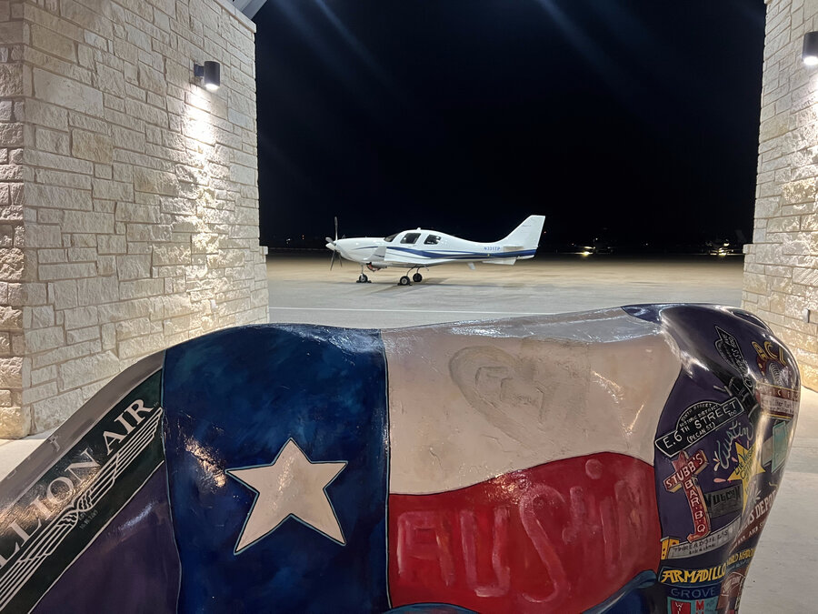 Lancair IV-P JetProp N331TP night ramp Austin Texas with longhorn statue